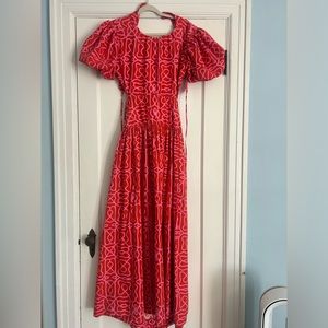 Beautiful agua by agua bendita red and pink dress with high neck and open back.